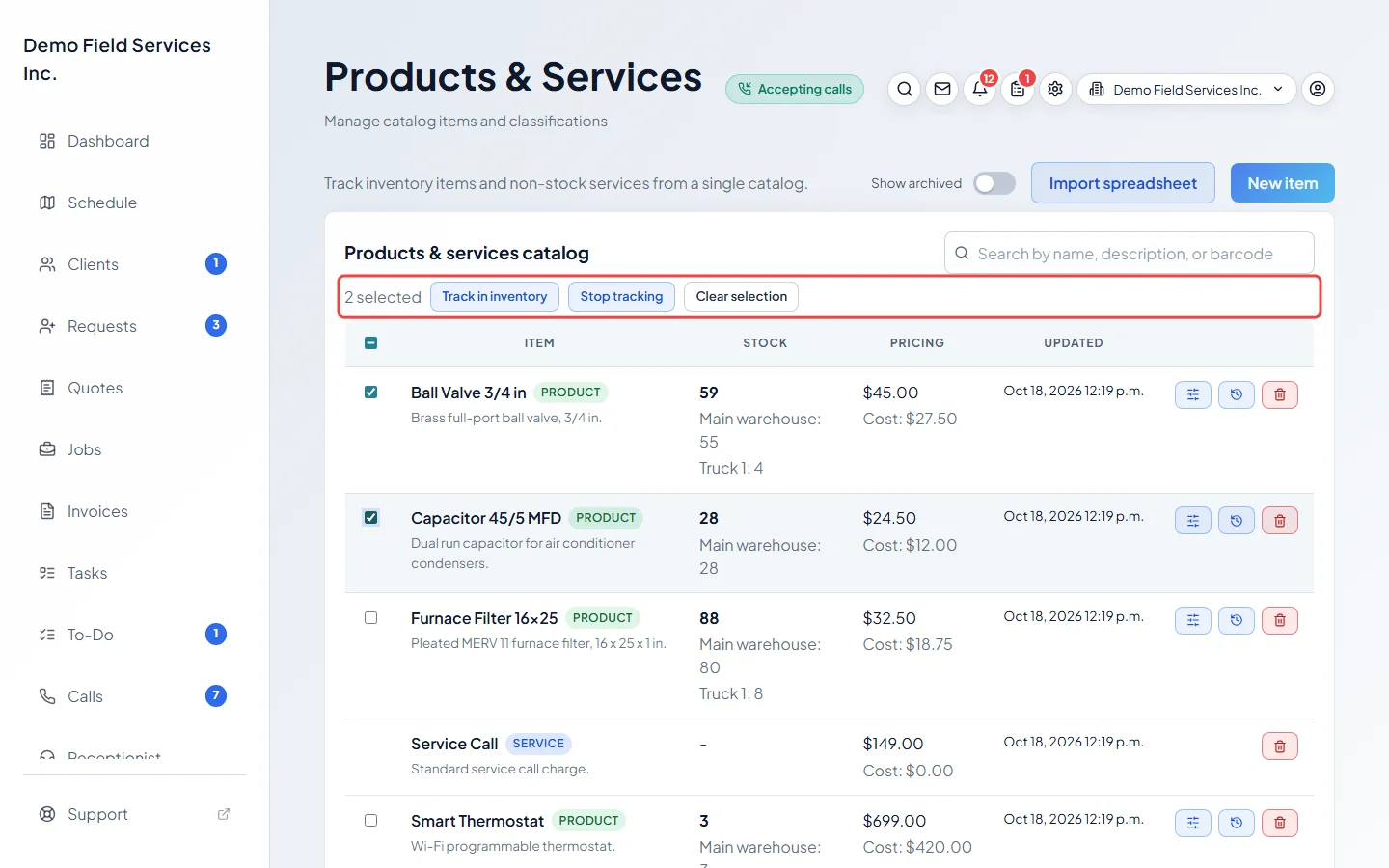 Two products ticked with the Track in inventory and Stop tracking buttons above the list