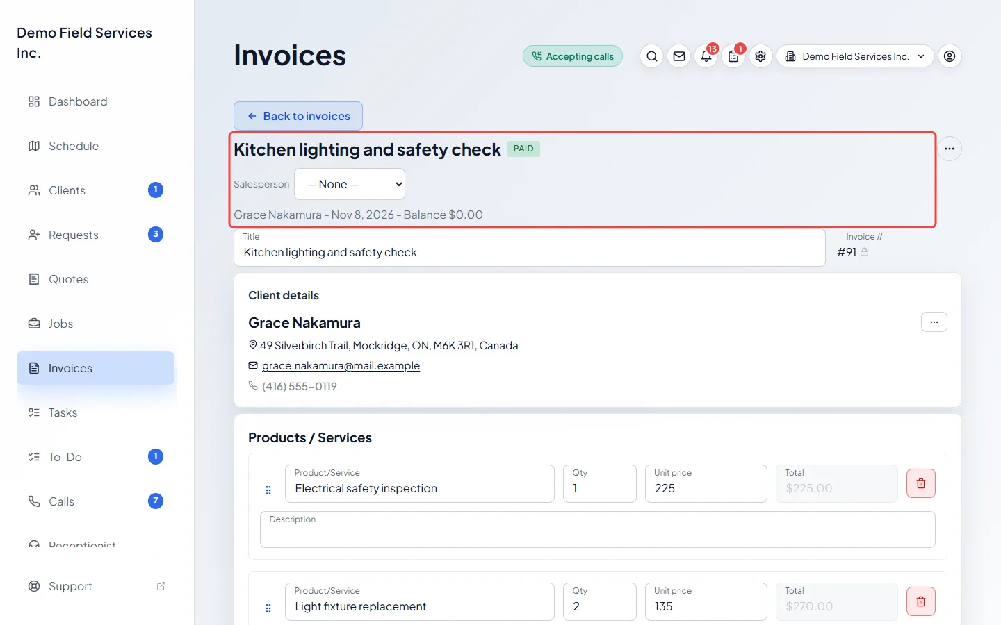 The top of the invoice with its Paid tag and a balance of zero