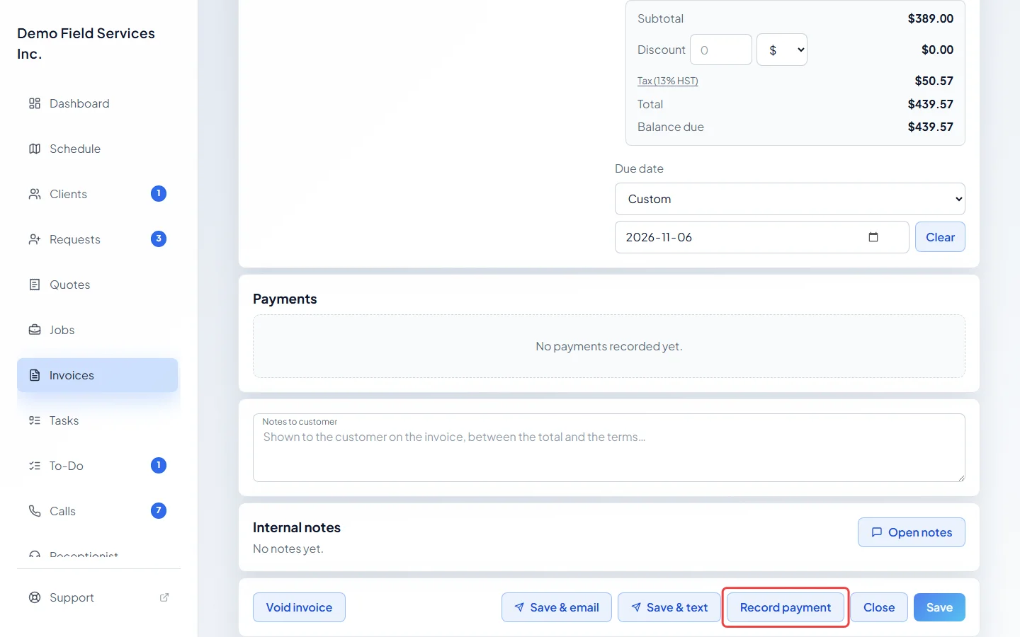 An invoice with the Record payment button highlighted